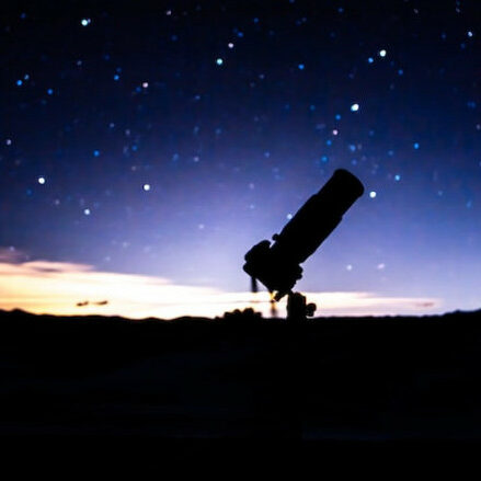 Telescope in night sky