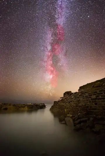 NIghtscape over water with broken wall